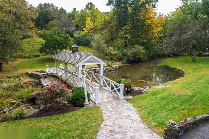 The covered bridge and pond in autumn color